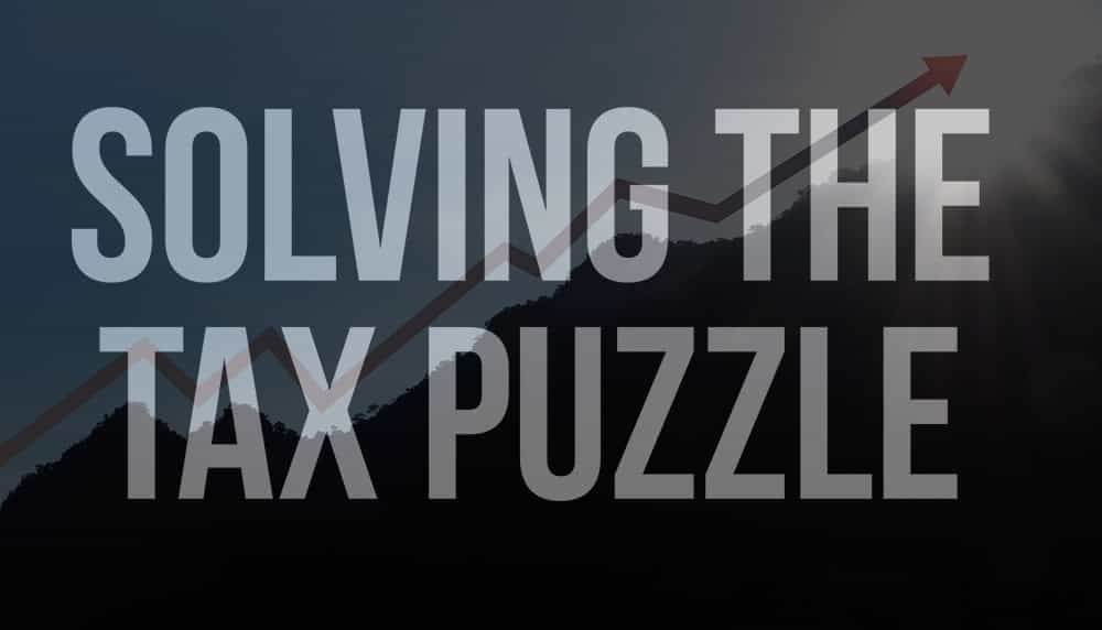 Solving the Tax Puzzle Text over a mountain with a graph line following the peaks.